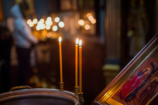 Lighted candle glowing inside a church for a Confirmation service — Confirmation Cards from Nordenzi