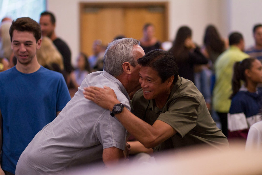 A member of the congregation embracing their pastor in a warm hug of gratitude during Pastor Appreciation Month — a Nordenzi gift guide feature