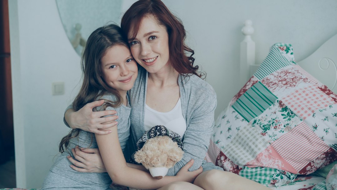 A mother and her adult daughter embracing warmly at home — Nordenzi Christian Gifts for Mom