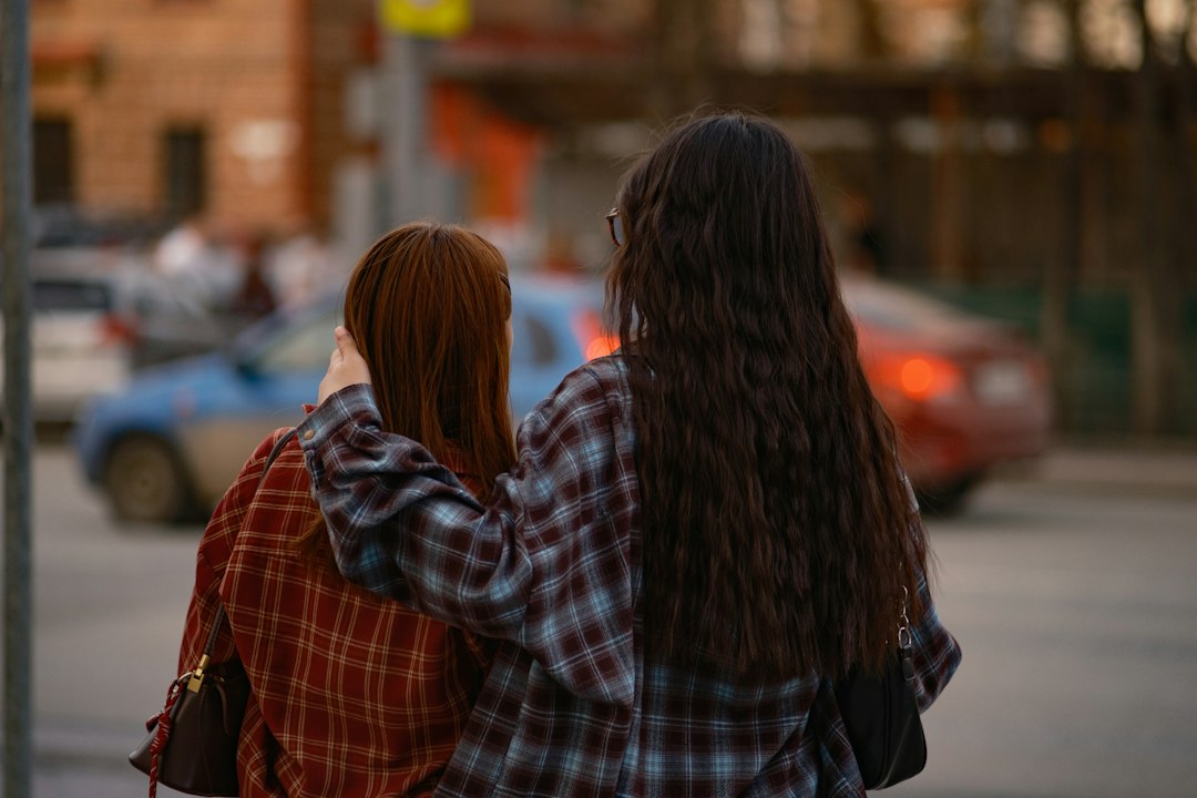 Two friends walking arm in arm, offering quiet Christian encouragement and support during a hard season