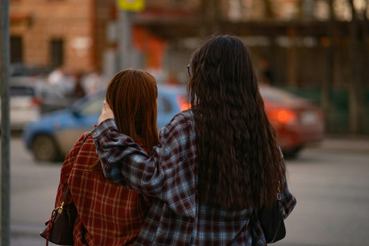 Two friends walking arm in arm, offering quiet Christian encouragement and support during a hard season