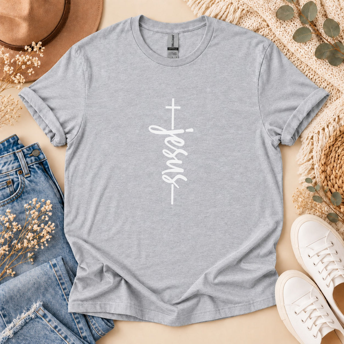 Grey t-shirt with white "Jesus" text and a cross graphic.