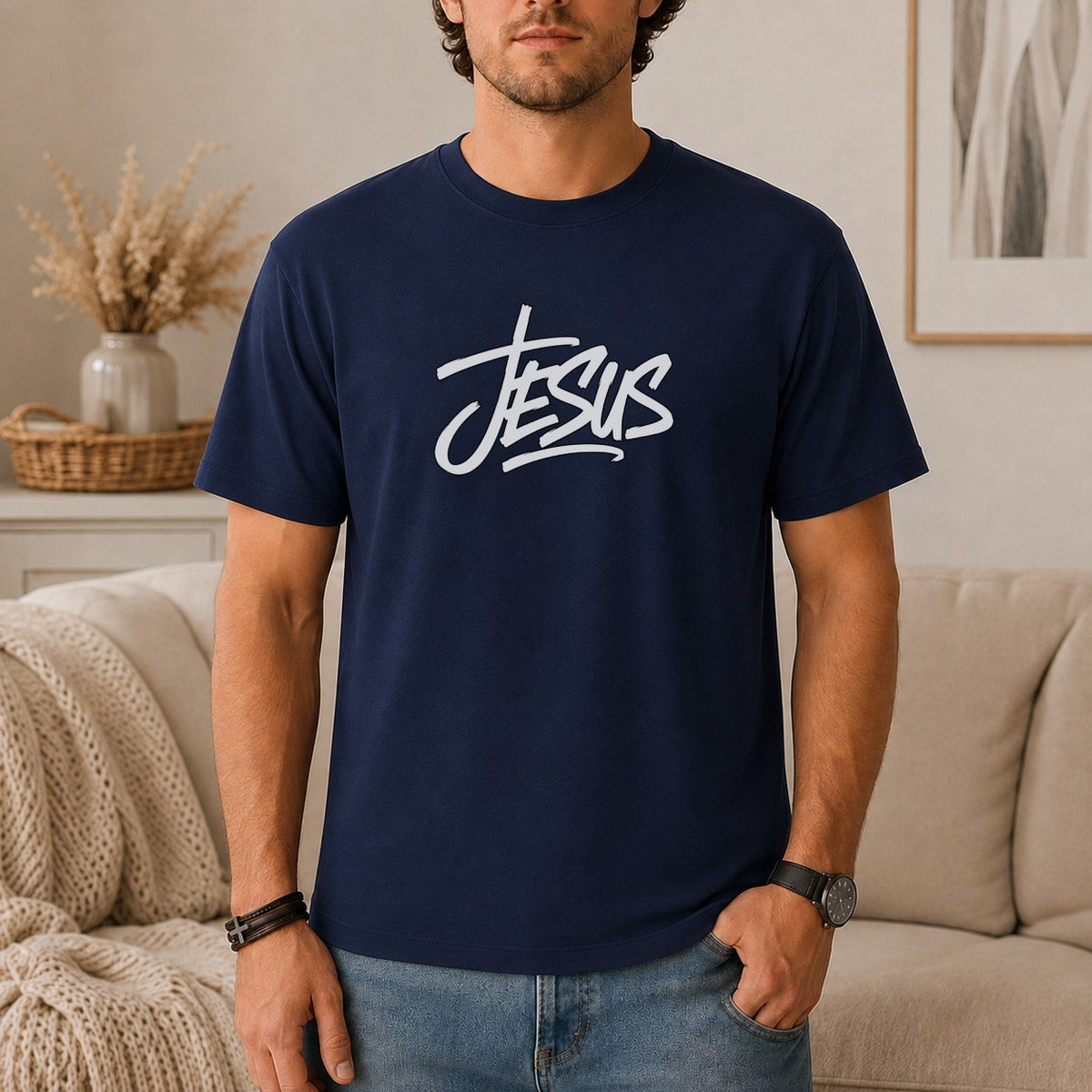 Navy t-shirt with white "Jesus" graphic, worn by a man.