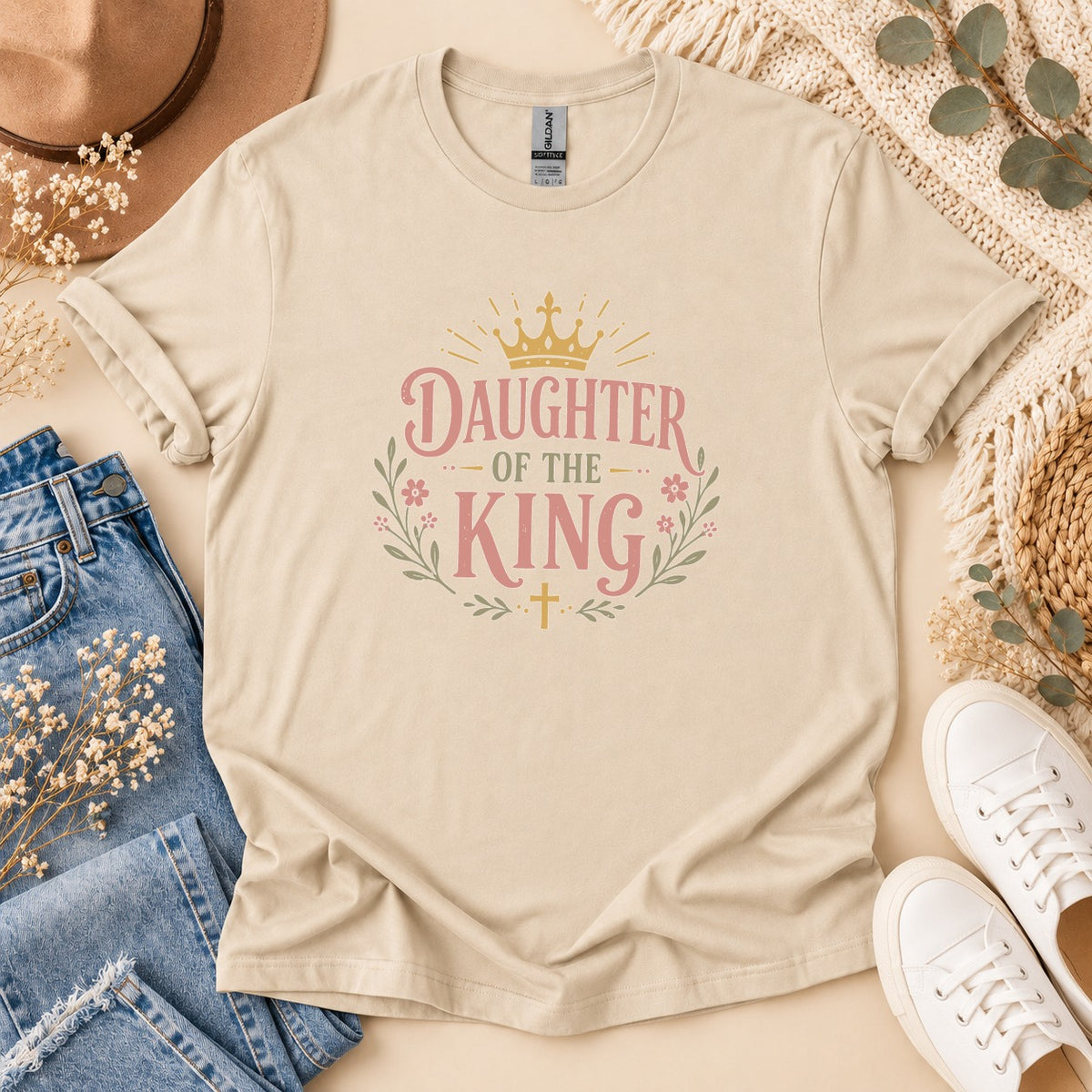 Beige t-shirt with "Daughter of the King" text and floral crown design.