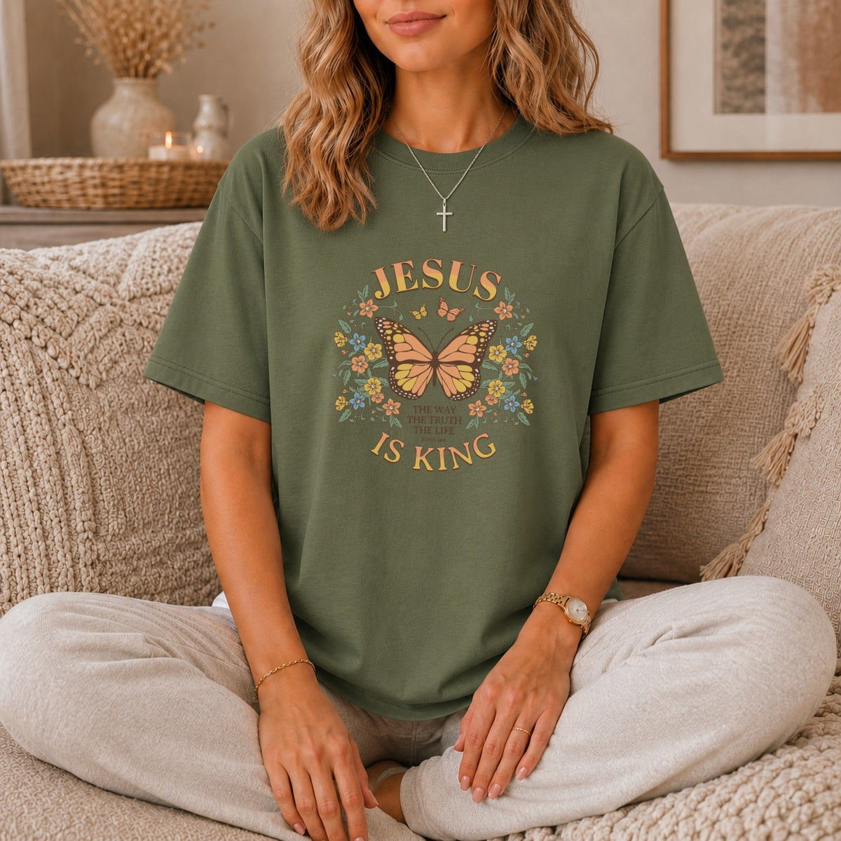 Olive t-shirt with "Jesus is King" and butterfly graphic.