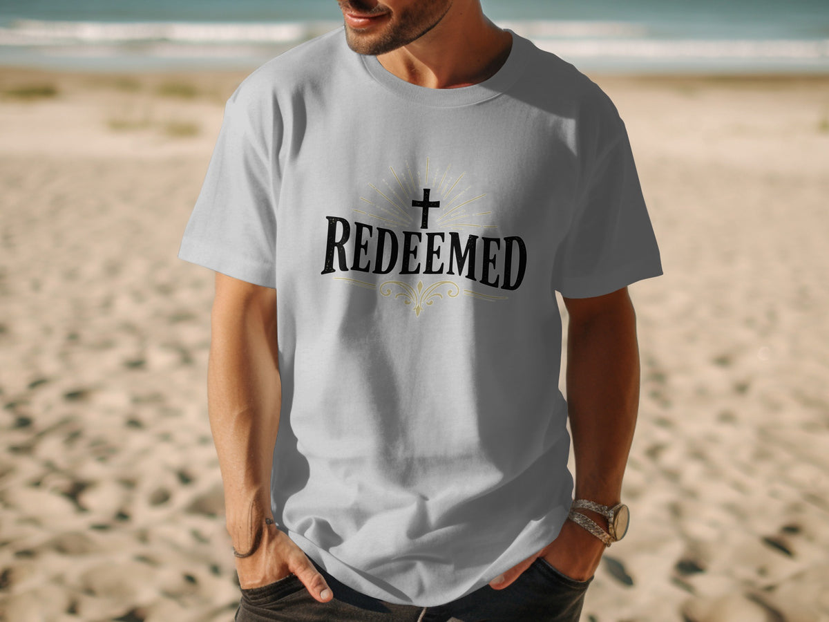 Grey t-shirt with "Redeemed" text and a cross design.