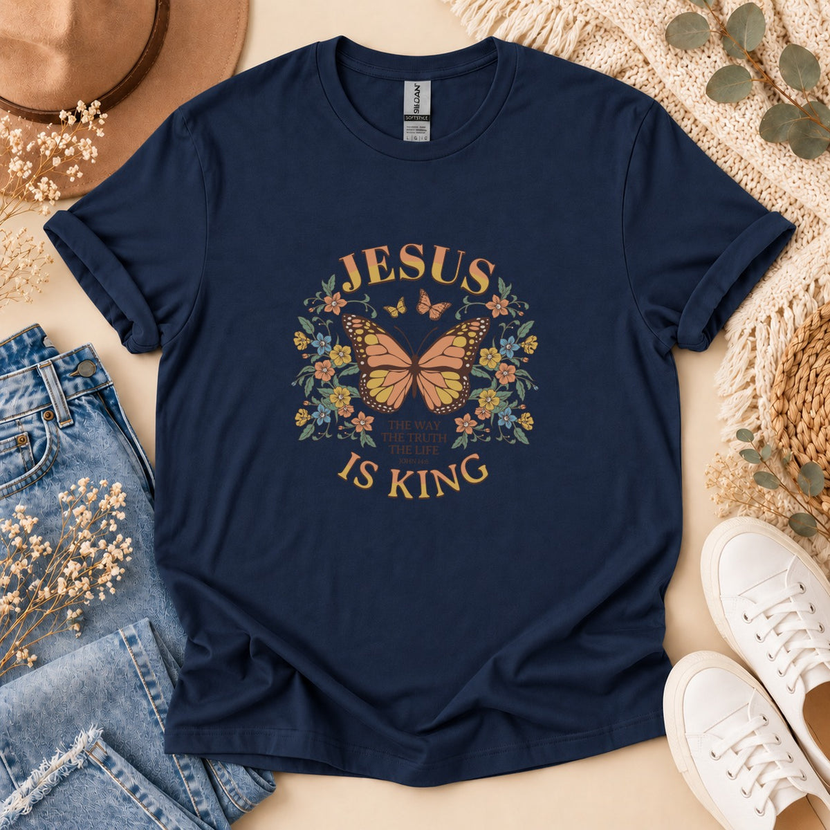 Navy t-shirt with "Jesus Is King" and butterfly graphic.