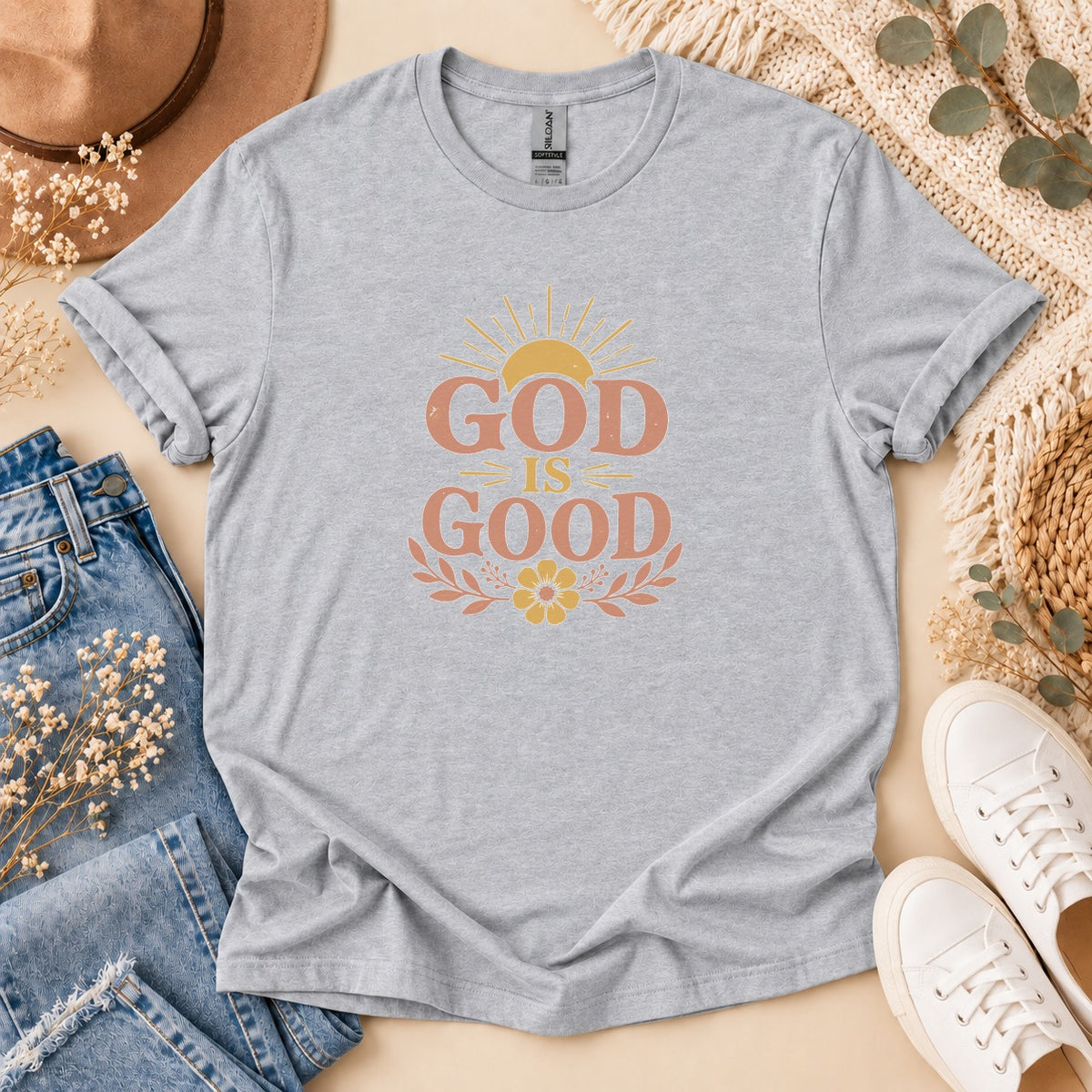 Light grey t-shirt with "GOD IS GOOD" text and sunburst graphic.