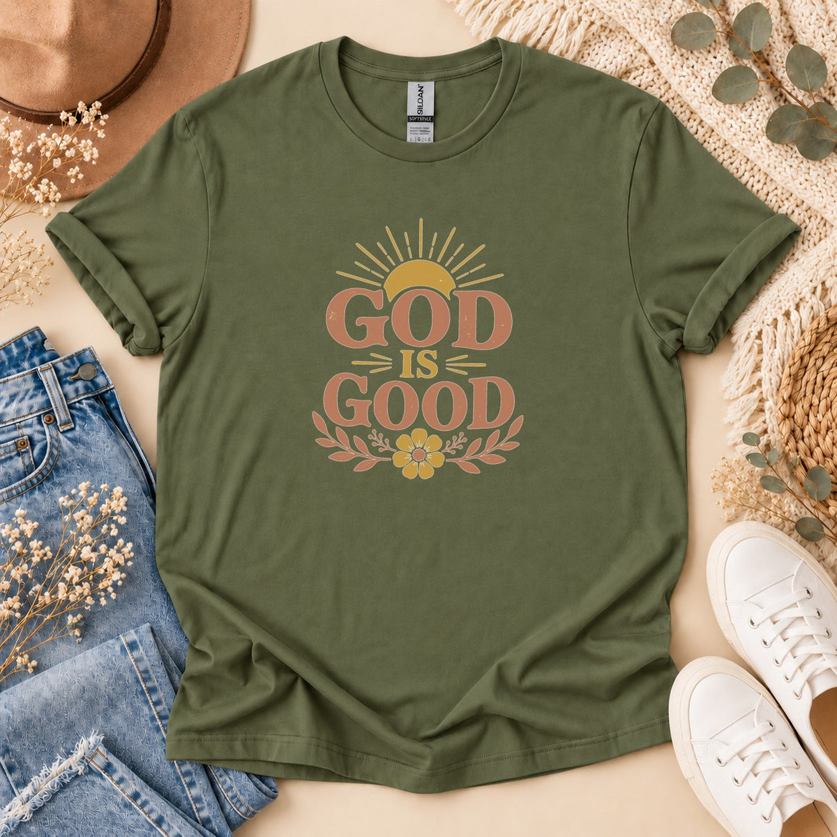 Olive green t-shirt with "GOD IS GOOD" graphic and sunburst design.