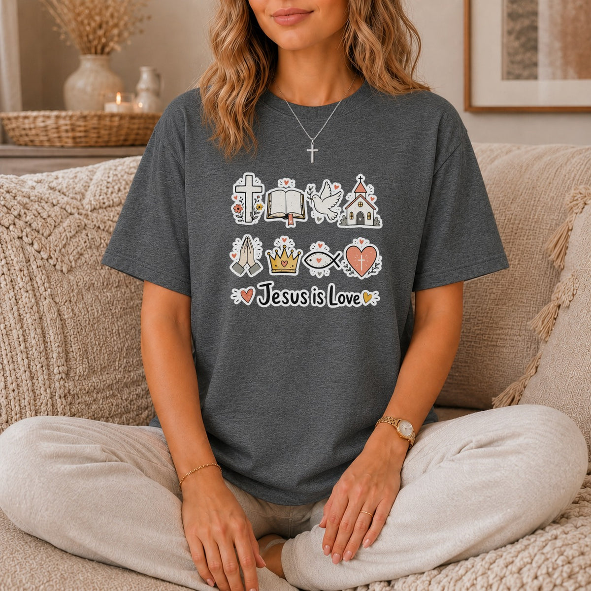 Dark grey t-shirt with religious icons and "Jesus is Love" text.