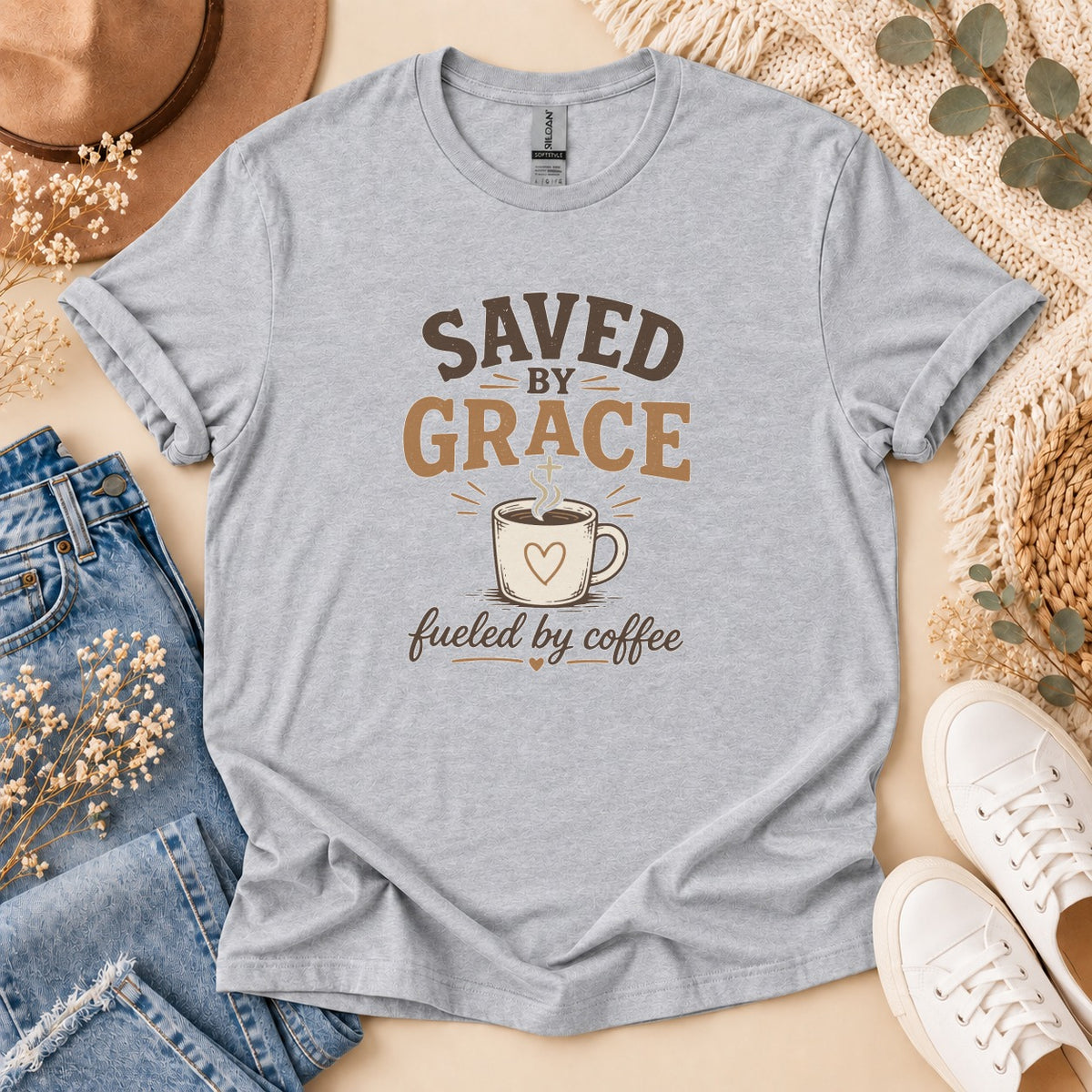 Light grey t-shirt with "Saved By Grace Fueled By Coffee" text and coffee cup graphic.