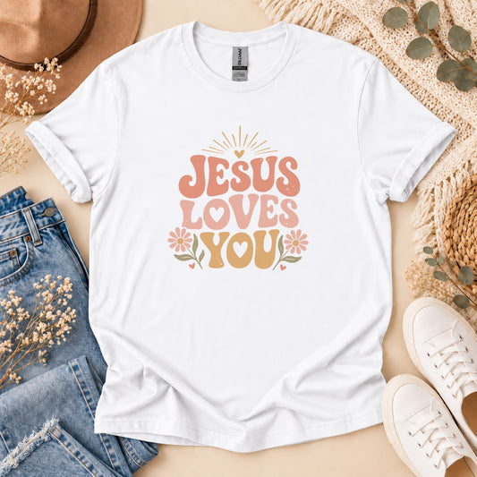 White t-shirt with "Jesus Loves You" text and floral graphics.