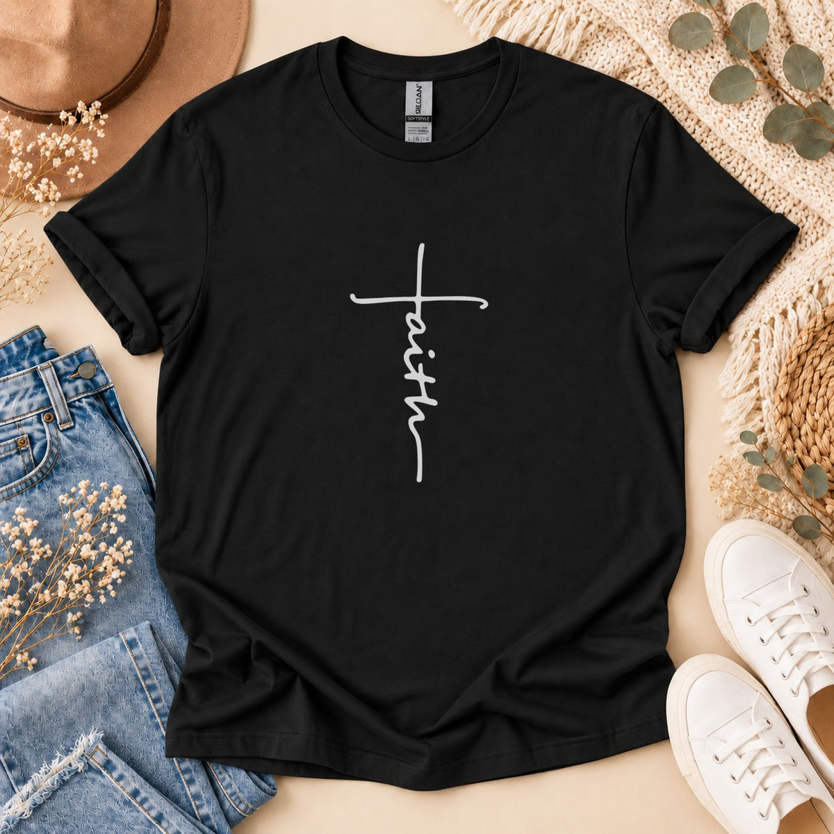 Black t-shirt with white "faith" text in a cross design.
