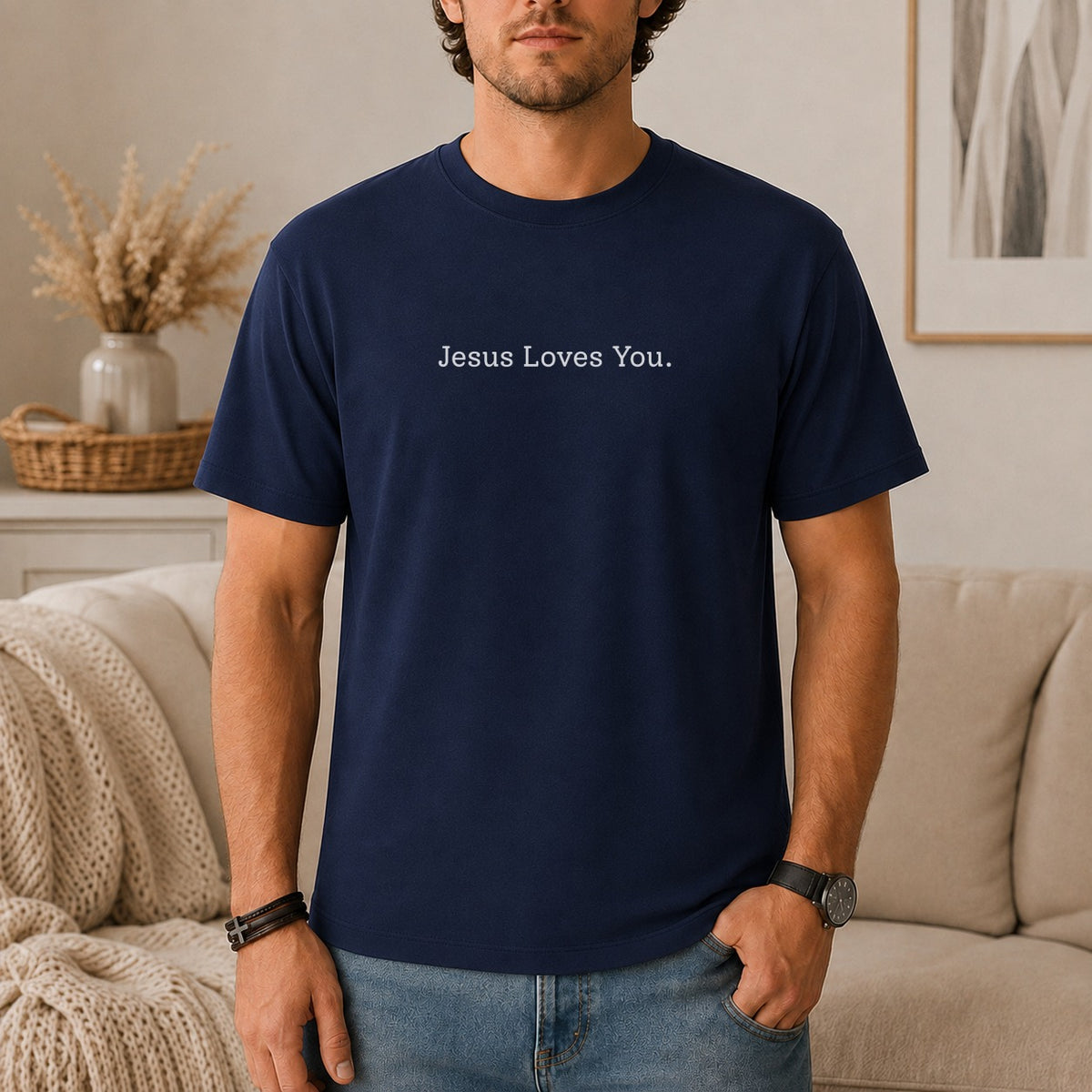 Navy t-shirt with "Jesus Loves You." text on chest.