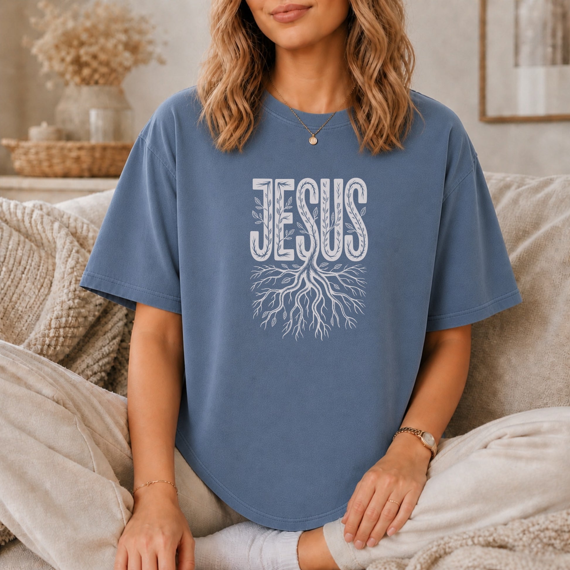Blue t-shirt with "Jesus" text and tree root design.