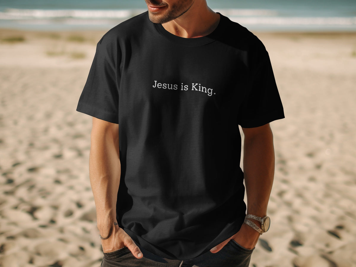 Black t-shirt with white text "Jesus is King." on the chest.