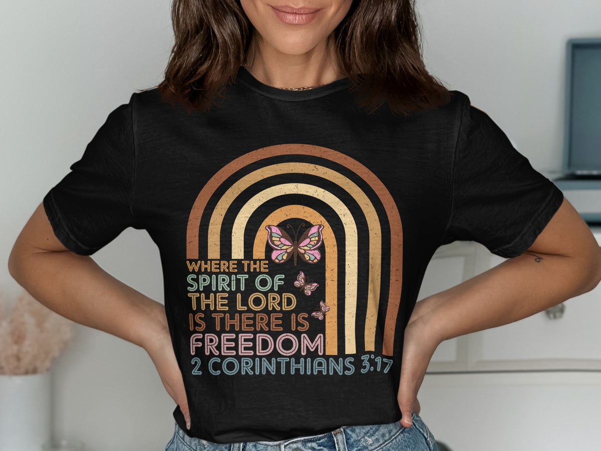 Black t-shirt with rainbow and butterflies, features text "Where the spirit of the Lord is there is freedom 2 Corinthians 3:17".