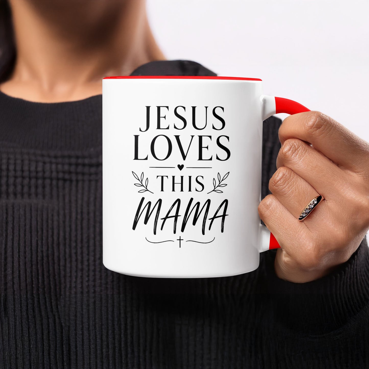 White mug with red handle, "Jesus Loves This Mama" text.