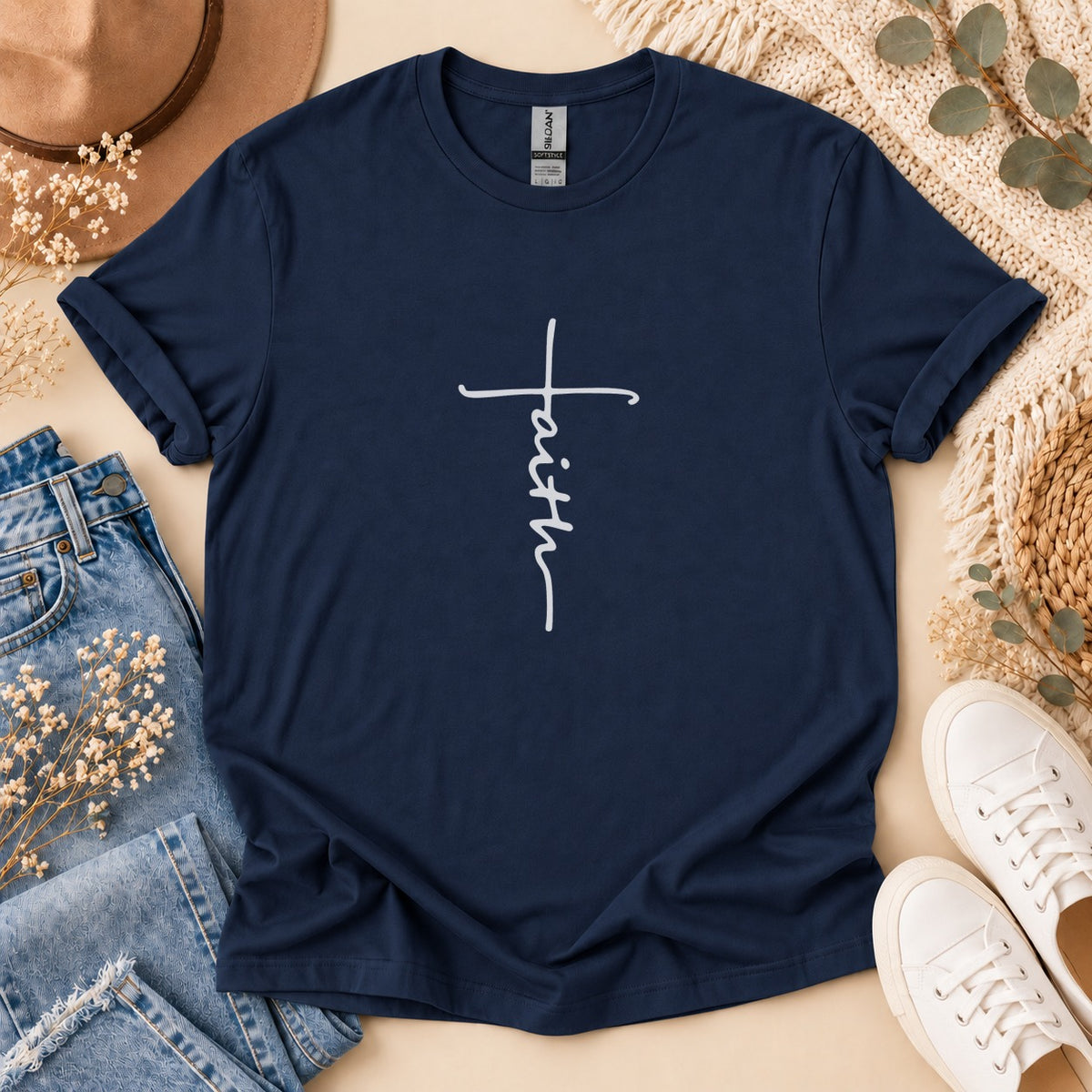 Navy t-shirt with white cursive "faith" cross design.