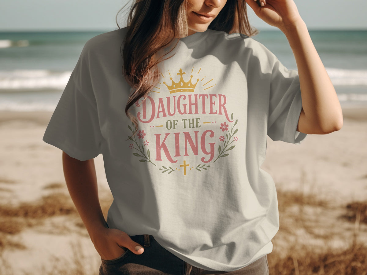 White t-shirt with "Daughter of the King" text, crown, and floral design.