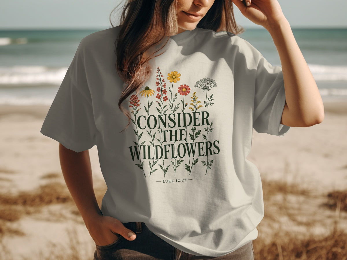 T-shirt with "Consider the Wildflowers Luke 12:27" text and floral graphic.