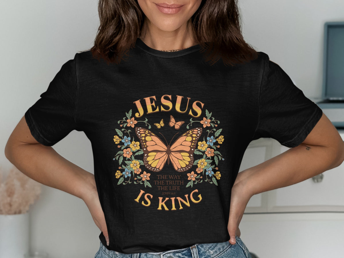Black t-shirt with a butterfly and floral design, reading "Jesus is King" and "The Way, The Truth, The Life."