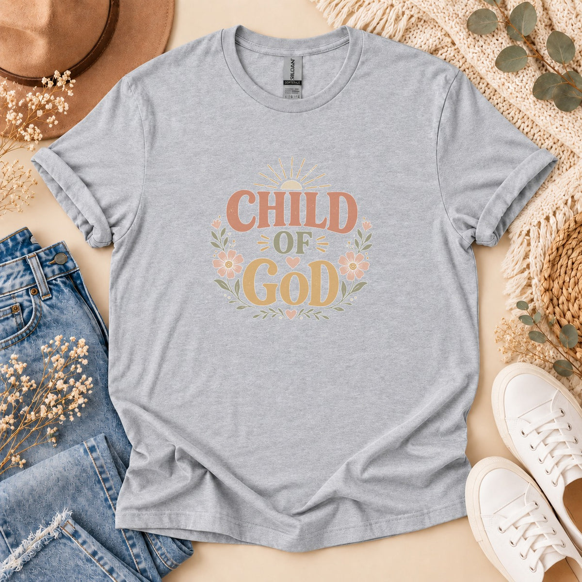 Light grey t-shirt with "CHILD OF GOD" text and floral design.