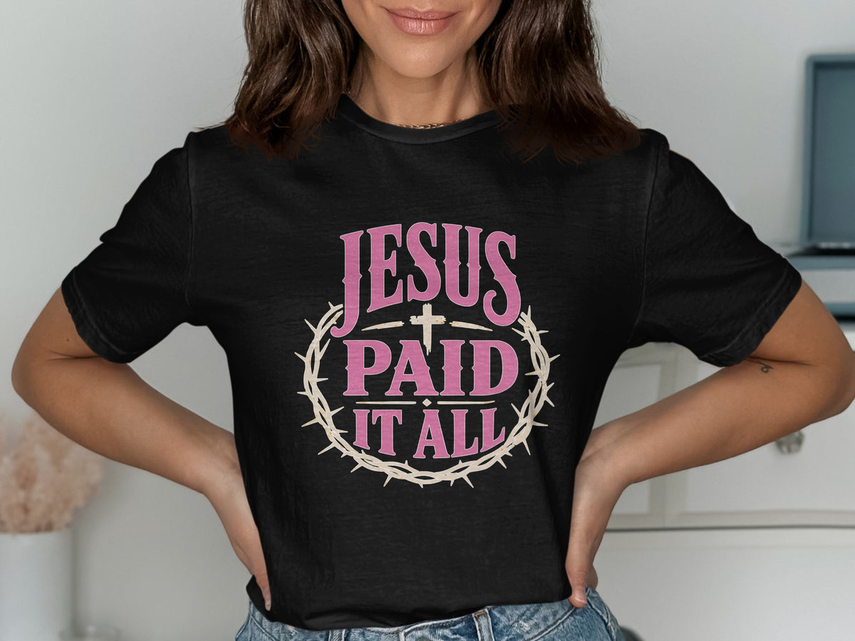 Black t-shirt with "JESUS PAID IT ALL" text and crown of thorns graphic.