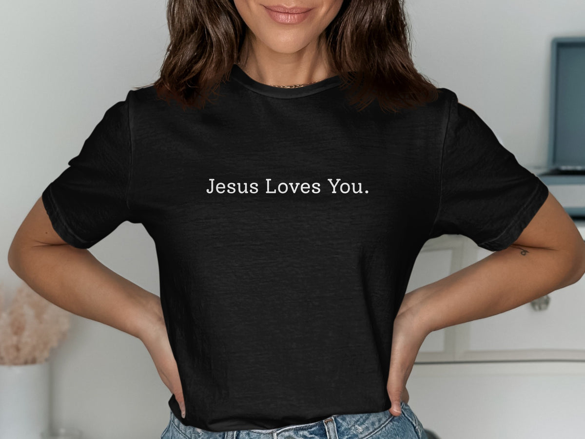 Black t-shirt with white text "Jesus Loves You."