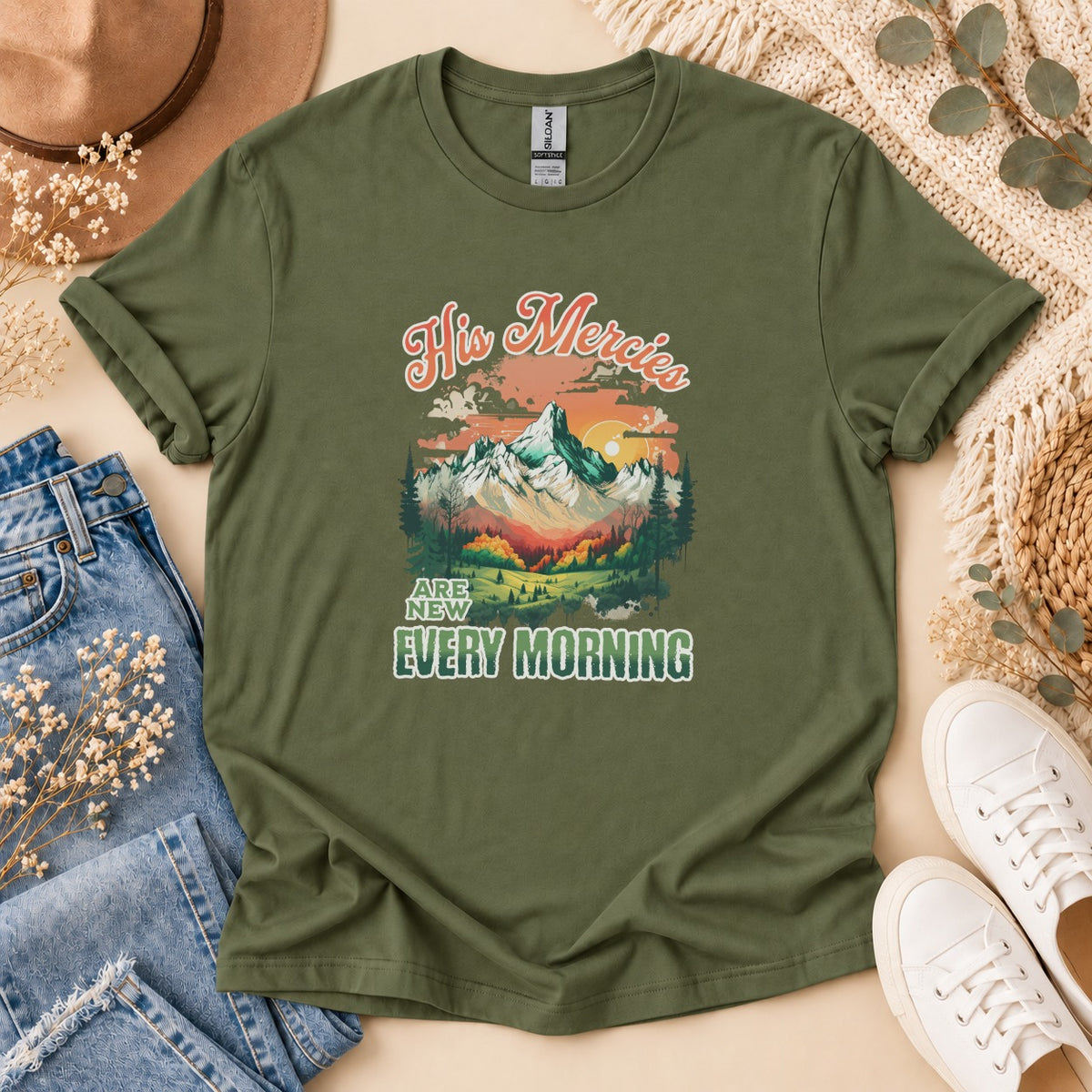 Olive t-shirt with "His Mercies Are New Every Morning" and mountain graphic.