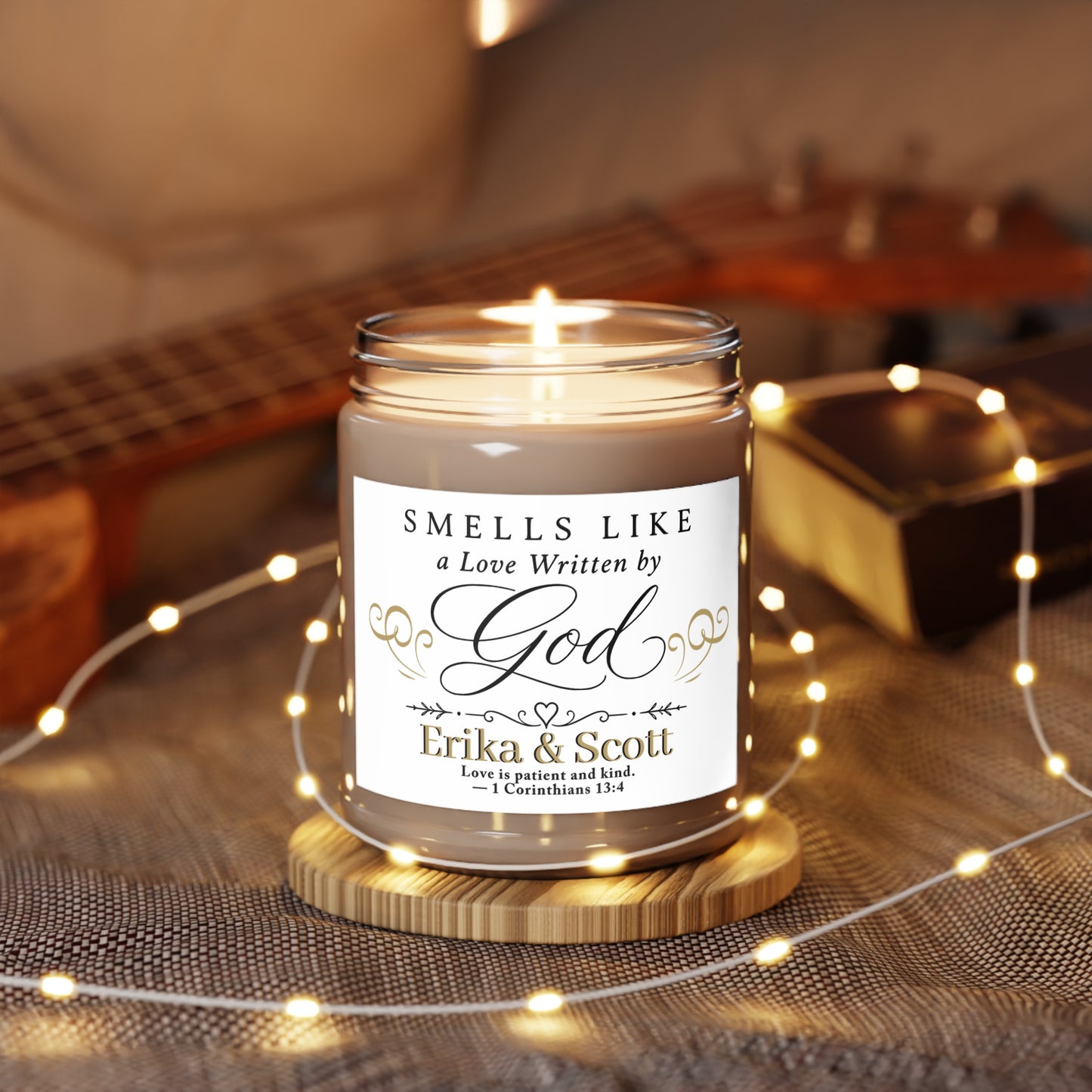 Candle with text "Smells Like a Love Written by God" and names.