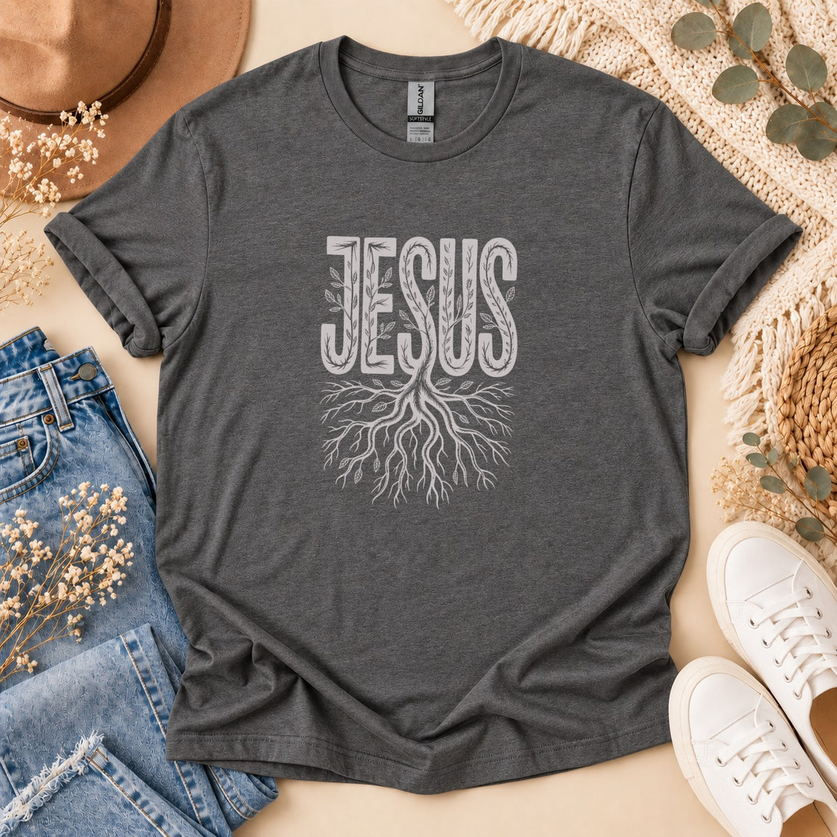 Dark grey t-shirt with "JESUS" text and tree roots graphic.