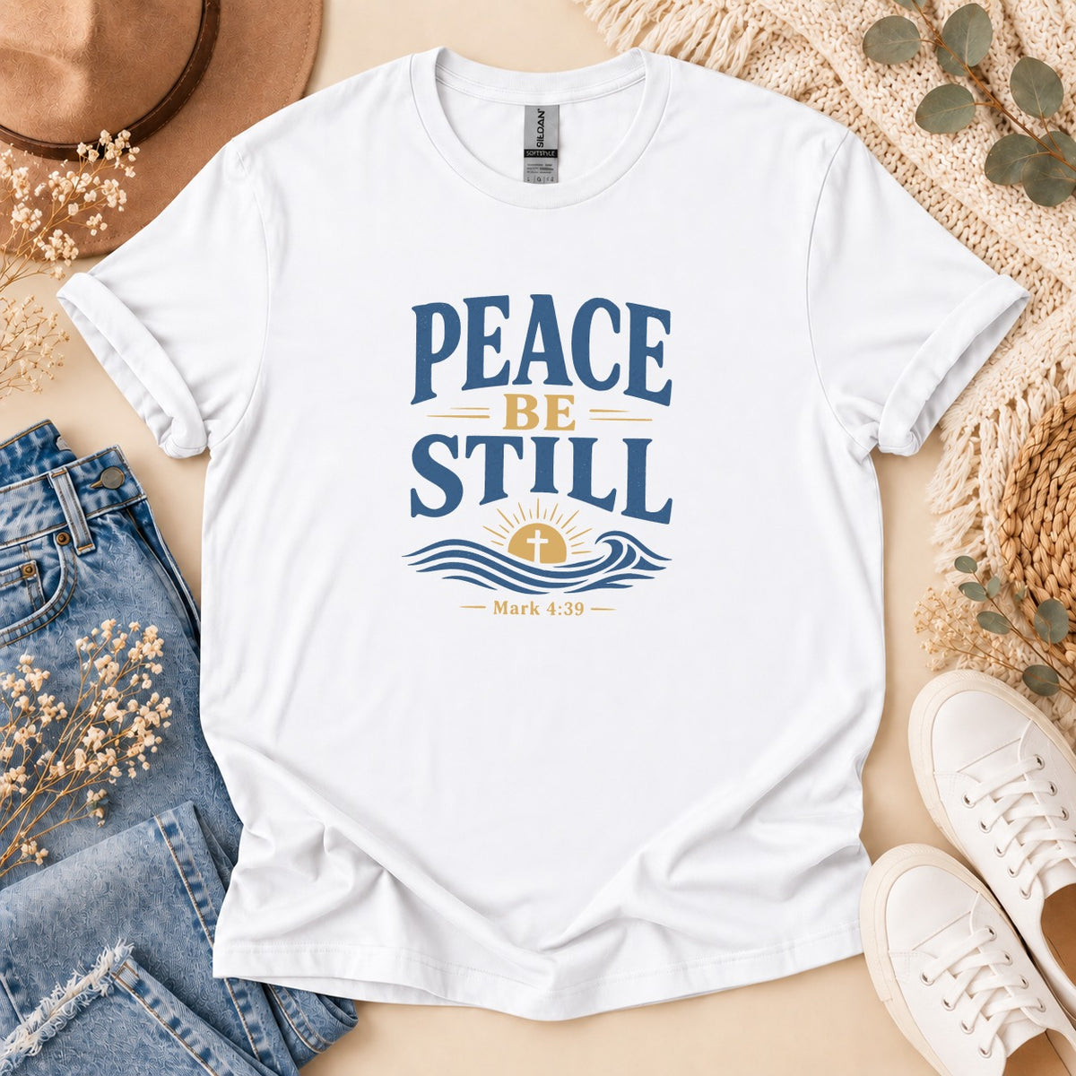 White t-shirt with "Peace Be Still" and Mark 4:39 graphic.