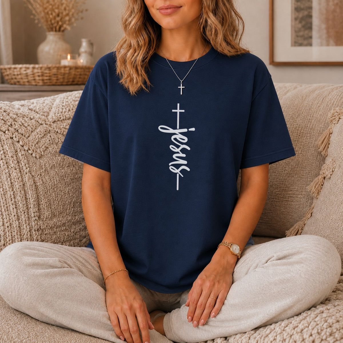 Navy t-shirt with vertical white "Jesus" text and cross graphic.