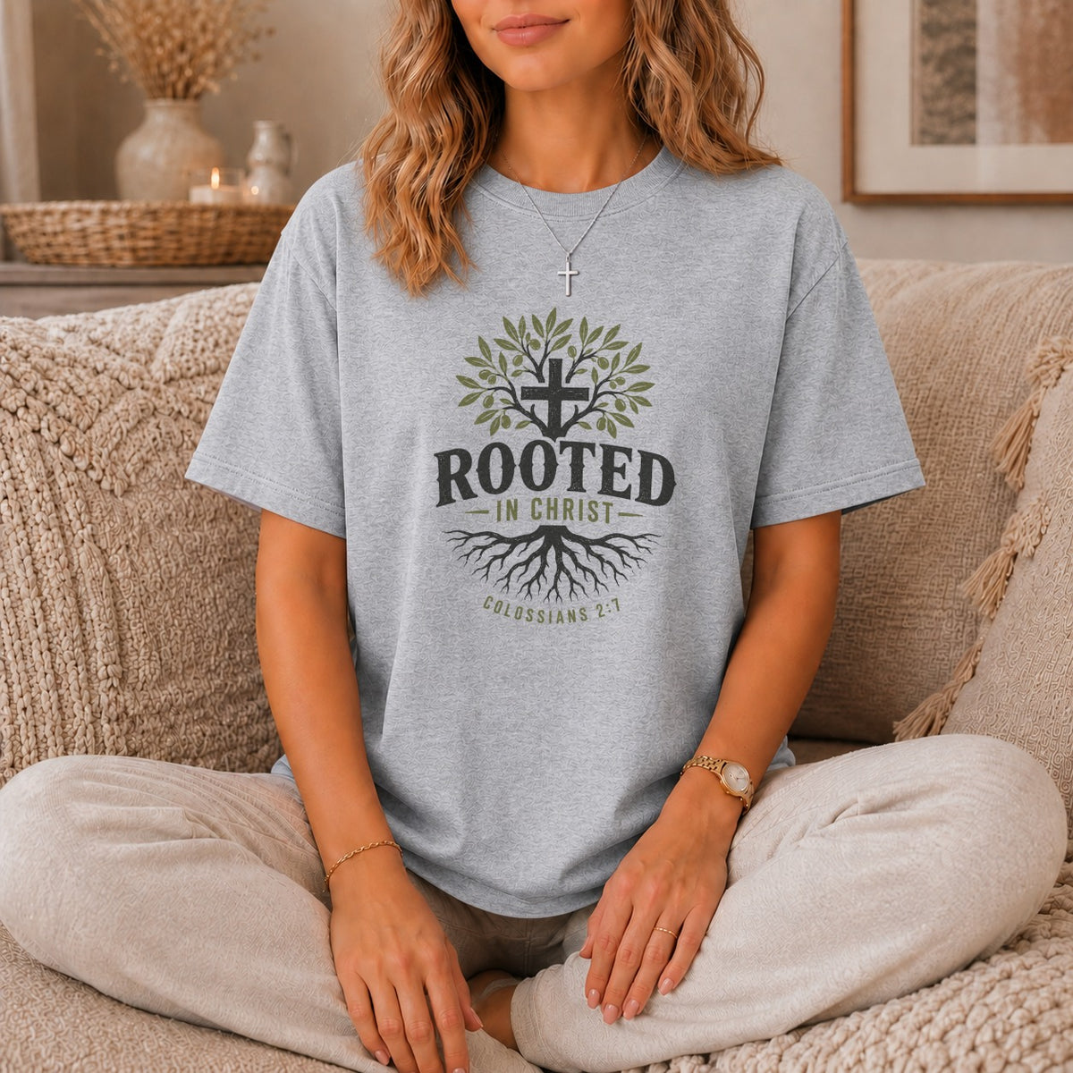 Grey t-shirt with tree, cross, and "ROOTED IN CHRIST" text, Colossians 2:7.