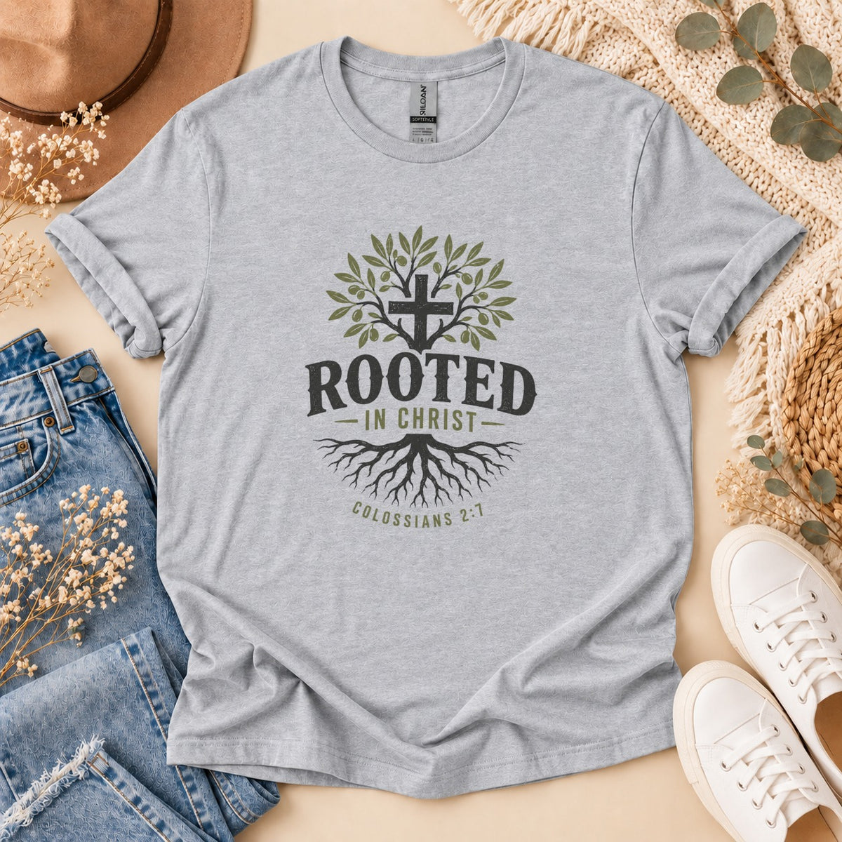 Grey t-shirt with "Rooted in Christ" and a cross with olive branches and roots.