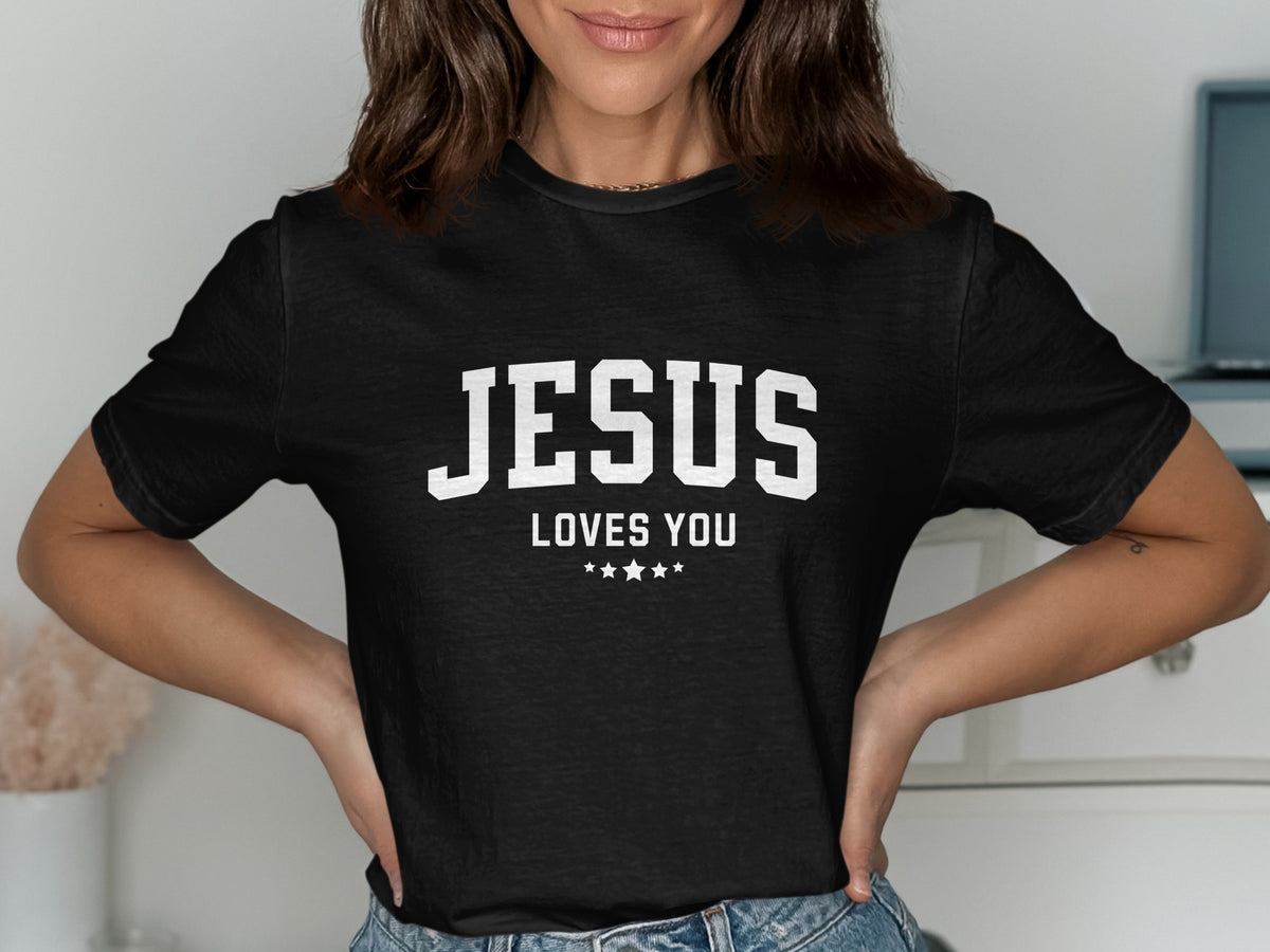 Black t-shirt with white text "JESUS LOVES YOU" and stars.