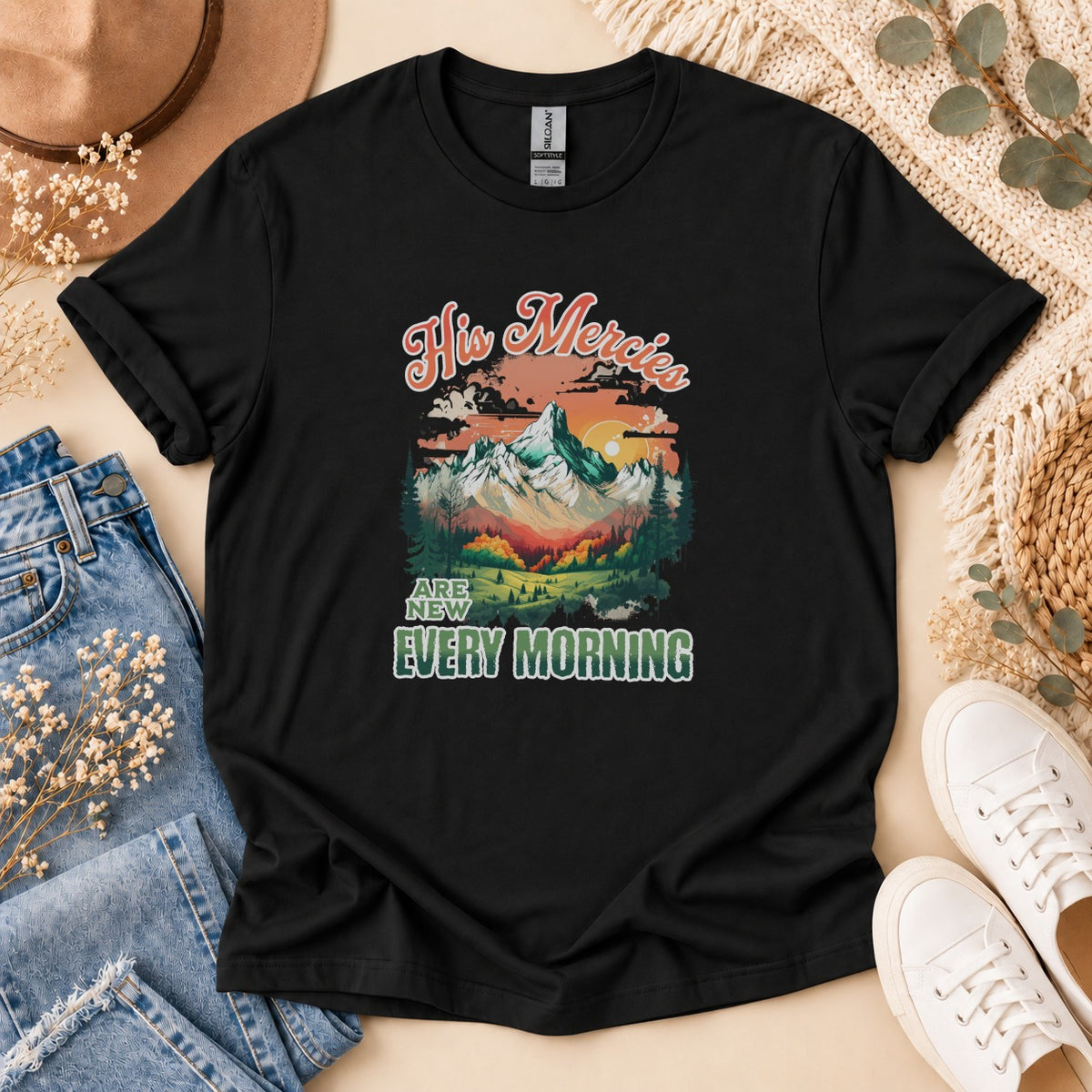 Black t-shirt with "His Mercies Are New Every Morning" and mountain landscape graphic.
