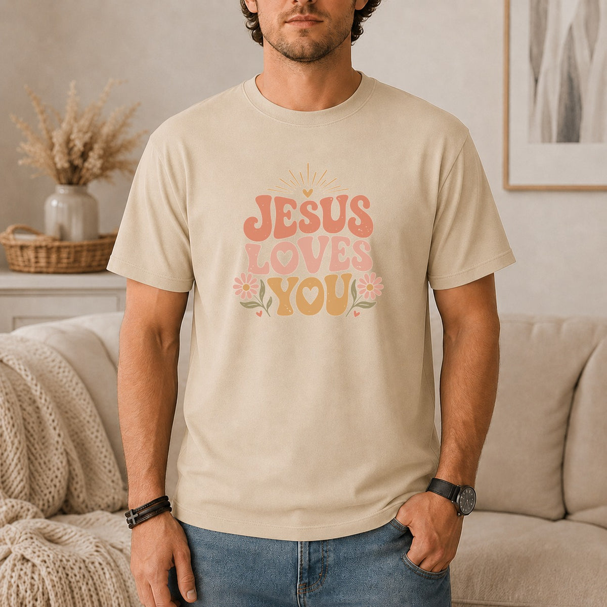 Light tan t-shirt with "JESUS LOVES YOU" text in pink and orange.