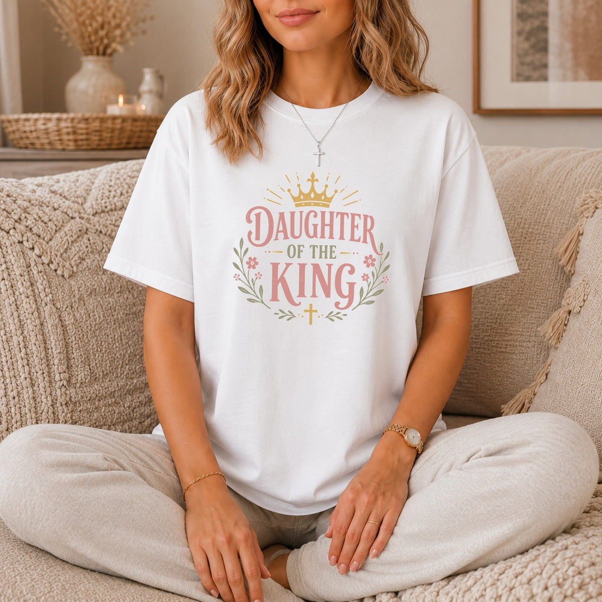 White t-shirt with "Daughter of the King" text and crown design.