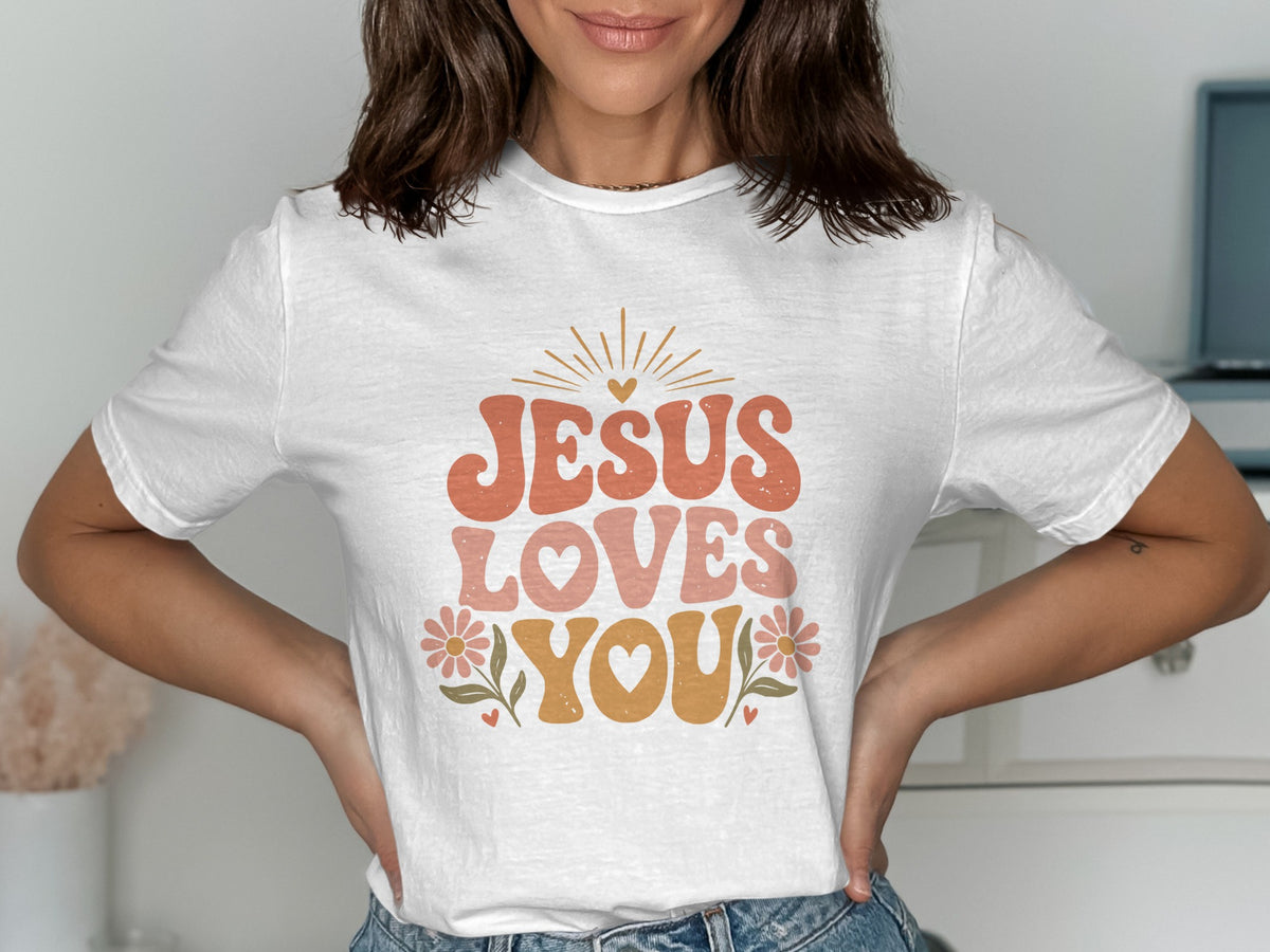White t-shirt with "Jesus Loves You" text and floral graphics.