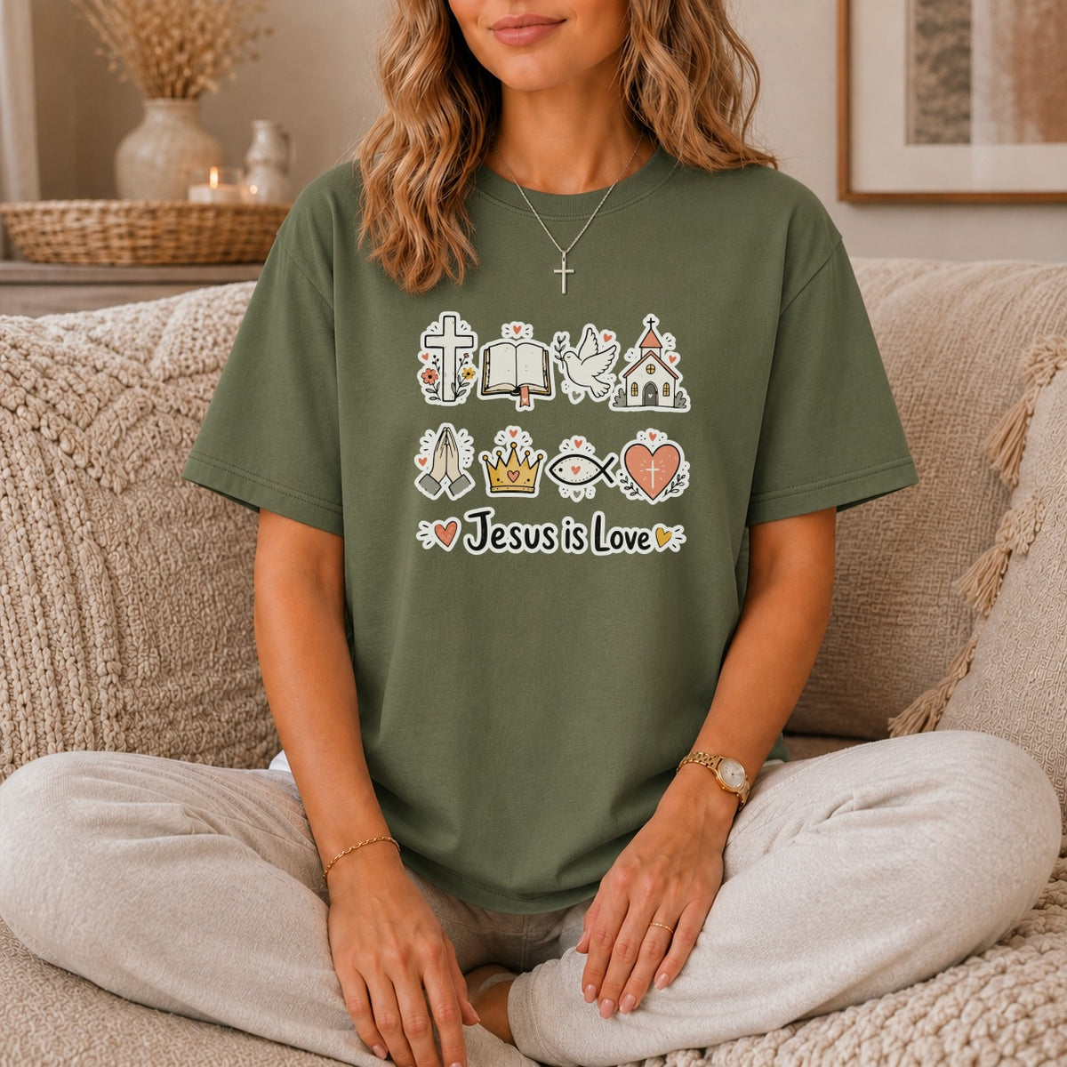 Green t-shirt with Christian symbols and "Jesus is Love" text.