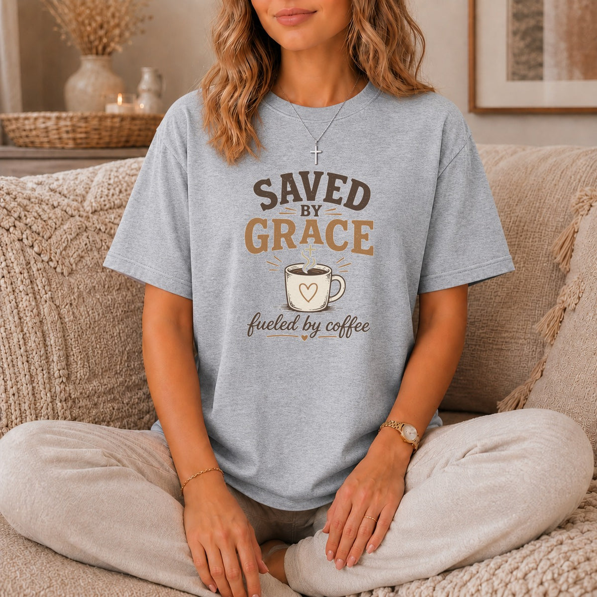Grey t-shirt with "Saved by Grace fueled by Coffee" graphic and coffee cup.