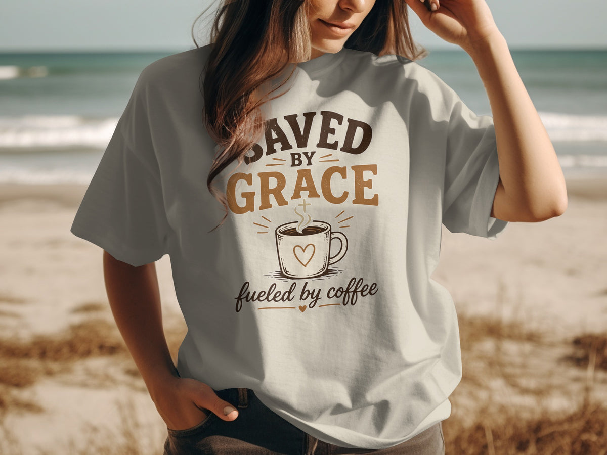 T-shirt with text "Saved by Grace fueled by coffee" and a coffee cup.