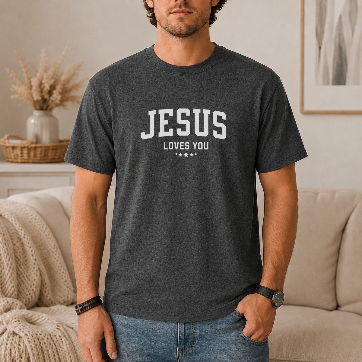 Dark grey t-shirt with "JESUS LOVES YOU" text and four small stars.