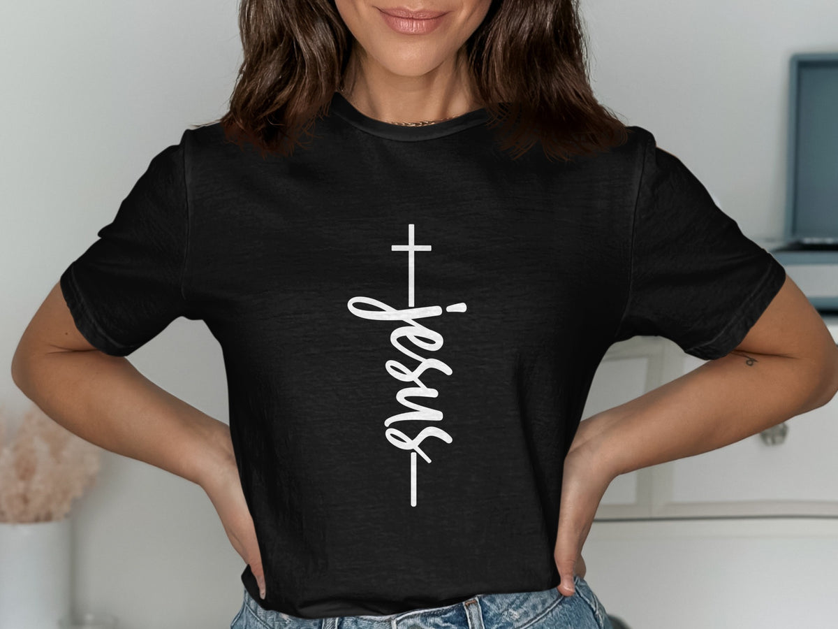 Black t-shirt with white cross and vertical "Jesus" text.