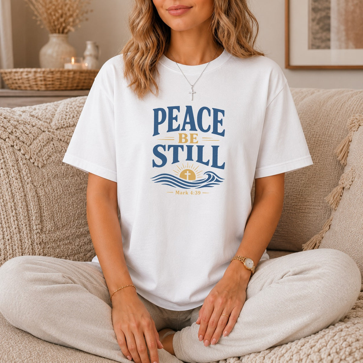 White t-shirt with "Peace Be Still" text and Mark 4:39 scripture.