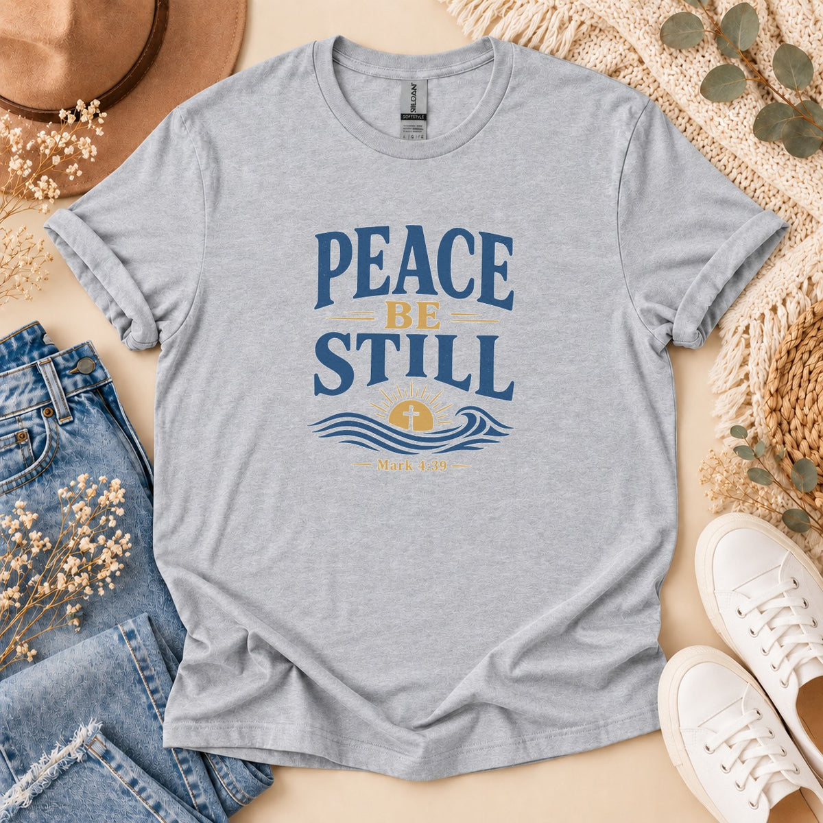 Grey t-shirt with "Peace Be Still" and Mark 4:39 verse graphic.