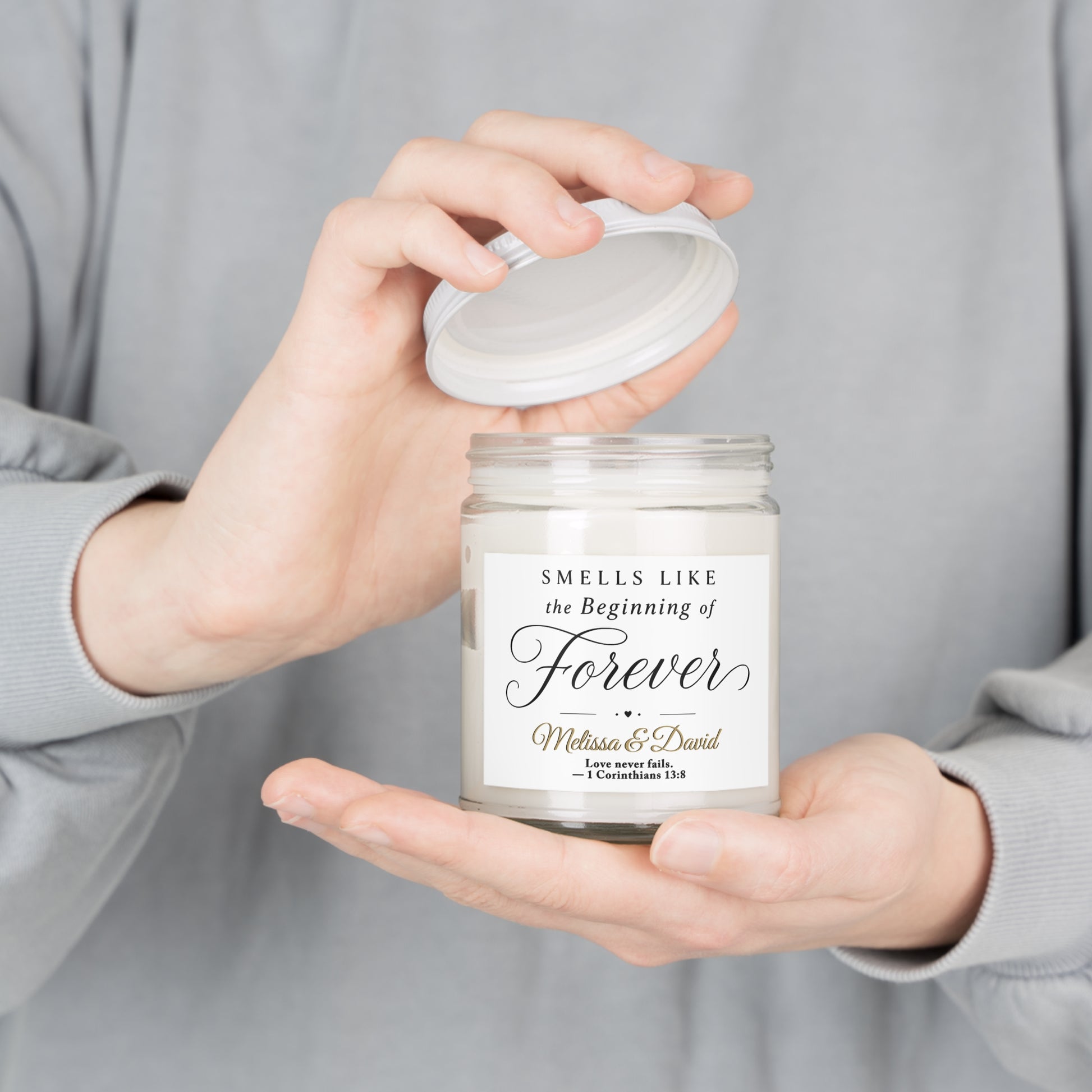 Candle with "Smells Like The Beginning of Forever" and names.
