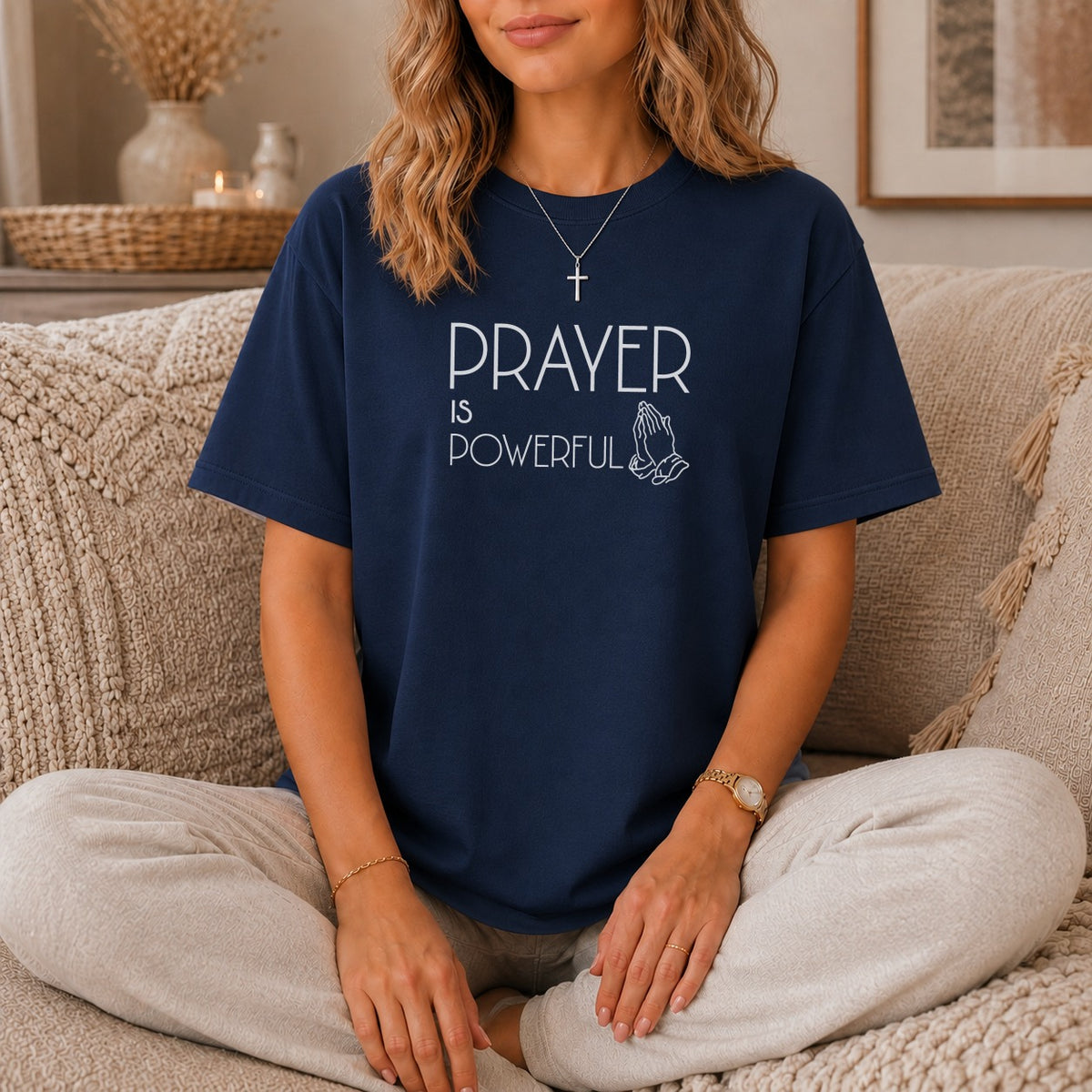 Dark blue t-shirt with "PRAYER IS POWERFUL" text and praying hands graphic.